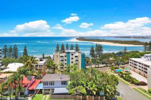 an aerial view of a city and the ocean at Aspect Caloundra in Caloundra