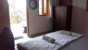 Postel nebo postele na pokoji v ubytování The Reinhold Guesthouse Bali