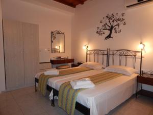 Posteľ alebo postele v izbe v ubytovaní Nisiotiko house in Tinos near the beach