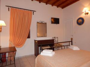 Posteľ alebo postele v izbe v ubytovaní Nisiotiko house in Tinos near the beach
