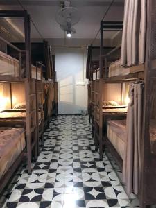 Postel nebo postele na pokoji v ubytování Chato Hostel