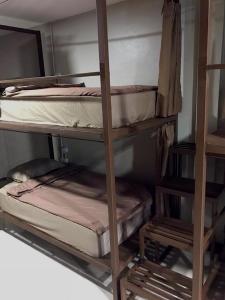 Postel nebo postele na pokoji v ubytování Chato Hostel