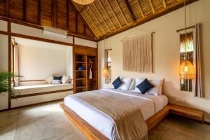 Säng eller sängar i ett rum på Green Escape Eco Resort