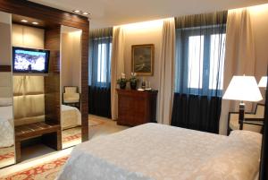 Postel nebo postele na pokoji v ubytování Hotel Excelsior