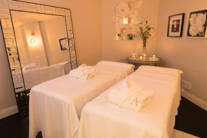Postel nebo postele na pokoji v ubytování A23 Boutique Hotel