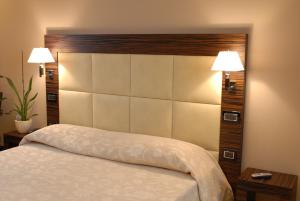 Postel nebo postele na pokoji v ubytování Hotel Excelsior