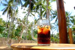 a glass mug of tea sitting on a table at Tentacle Bali in Nusa Penida