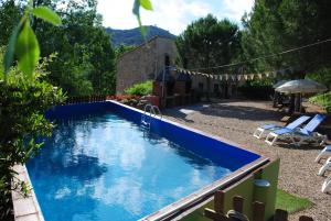 The swimming pool at or close to Masia El Canalot - Molí Del Pont