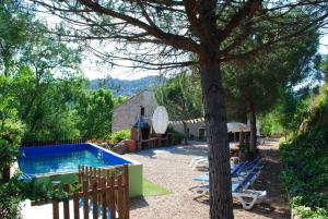 The swimming pool at or close to Masia El Canalot - Molí Del Pont
