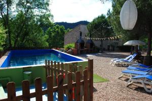 The swimming pool at or close to Masia El Canalot - Molí Del Pont