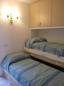 Posteľ alebo postele v izbe v ubytovaní Residenze Paradiso