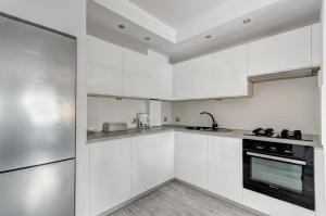 Kuchyňa alebo kuchynka v ubytovaní Prime Apartments - Skandynawski + 2 fotografie