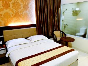 Кровать или кровати в номере De Best Hotel