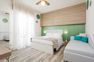 Postel nebo postele na pokoji v ubytování Hotel Albatros