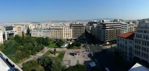 an aerial view of a city with tall buildings at Athens Center Panoramic Flats in Athens