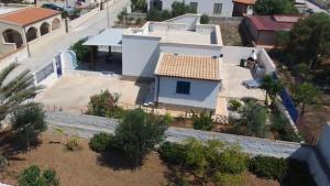 arial view of a white house with a roof at Villa Sunshine in Triscina