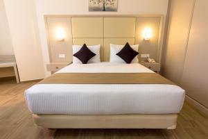Postel nebo postele na pokoji v ubytování Hôtel Sidi Yahia