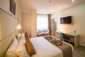 Postel nebo postele na pokoji v ubytování Hôtel Sidi Yahia