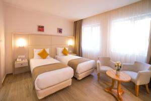Postel nebo postele na pokoji v ubytování Hôtel Sidi Yahia