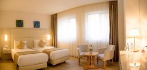 Postel nebo postele na pokoji v ubytování Hôtel Sidi Yahia