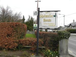 a sign for a restaurant on the side of a road at Shelmalier House in Athlone