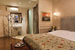 Cama ou camas em um quarto em Kitapevi Hotel