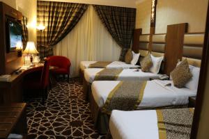 Ένα ή περισσότερα κρεβάτια σε δωμάτιο στο Province Al Sham Hotel