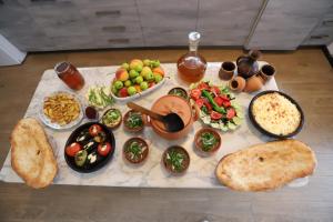 a table with different types of food on it at Papazo in Kutaisi