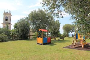 a playground with two play equipment in a park at Casa Andreina in Toscolano Maderno