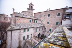 a view from the roof of a building with a clock tower at Hotel I Tigli albergo diffuso in Corinaldo