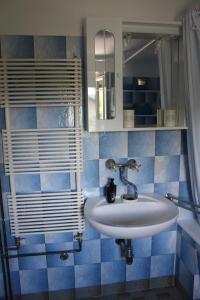 a bathroom with a sink and a mirror at R&G APARTMENT in Žirovnica +26 photos