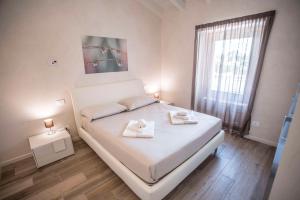 Posteľ alebo postele v izbe v ubytovaní Relais Madergnago