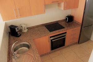 A kitchen or kitchenette at Beautiful Ocean View Apartment