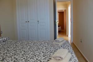 A bed or beds in a room at Beautiful Ocean View Apartment