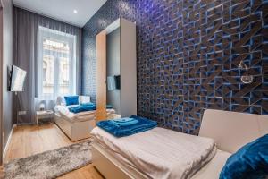 Budapest Broadway Apartment tesisinde bir odada yatak veya yataklar