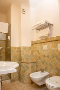 Koupelna v ubytování Hotel Cristalda