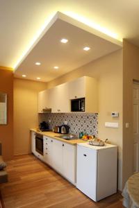 A kitchen or kitchenette at Orchidea Apartman Eger
