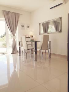 a dining room with a table and chairs at Ivana Šibenik in Šibenik