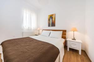 Postel nebo postele na pokoji v ubytování Apartment Alex