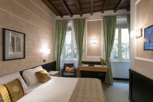 A bed or beds in a room at DK Suites