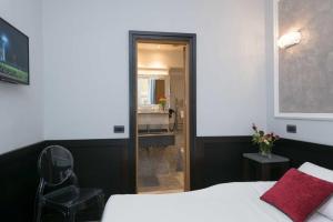 A bed or beds in a room at DK Suites