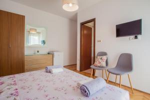 Postel nebo postele na pokoji v ubytování Guesthouse Maver