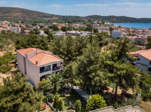 an aerial view of a white house with trees at Villa Katerina in Potos