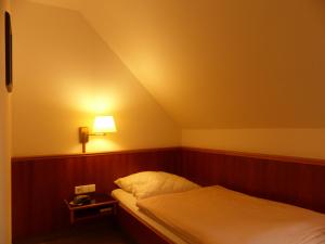 Ein Bett oder Betten in einem Zimmer der Unterkunft Hotel Dorotheenhof