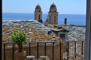 a view of a stone building with two towers at Appartement Casalea - Casadibastia - Bastia centre in Bastia