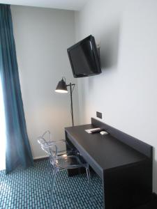 TV a/nebo společenská místnost v ubytování Dav'hotel Jaude