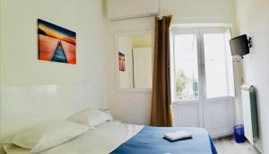 Postel nebo postele na pokoji v ubytování Residence Nina