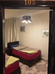 A bed or beds in a room at Wake Up! Cairo Hostel