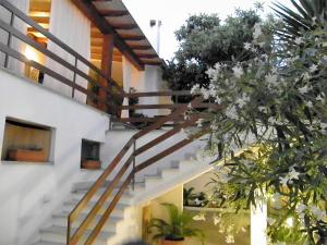 a staircase in a house with flowering plants at casa del Sole in La Caletta