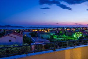 a view of a city at night at Apartment Alex in Zadar